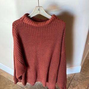 Burnt orange turtle neck sweater from Free People.